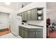 White and gray kitchen with updated countertops and cabinets at 8088 Spanish Oak Dr, Spring Hill, FL 34606