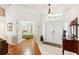 Bright entryway with hardwood floors and view of bedroom at 8088 Spanish Oak Dr, Spring Hill, FL 34606
