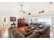Living area with hardwood floors, sectional sofa and high ceilings at 8088 Spanish Oak Dr, Spring Hill, FL 34606