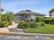 Community clubhouse with outdoor seating and landscaping at 2424 W Tampa Bay Blvd # L-302, Tampa, FL 33607