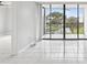 Living room with sliding glass doors to balcony and water view at 2424 W Tampa Bay Blvd # L-302, Tampa, FL 33607