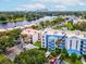 Aerial view of a condo building near the water, showcasing its location and access at 2424 W Tampa Bay Blvd # L-302, Tampa, FL 33607