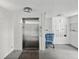 Building lobby with elevator and mailboxes at 2424 W Tampa Bay Blvd # L-302, Tampa, FL 33607