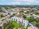 Aerial view of condo building with surrounding landscape and parking at 2424 W Tampa Bay Blvd # L-302, Tampa, FL 33607
