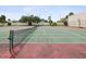Outdoor tennis court with net and lights at 2424 W Tampa Bay Blvd # L-302, Tampa, FL 33607