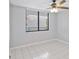 Bright bedroom with tile floors and ceiling fan at 2424 W Tampa Bay Blvd # L-302, Tampa, FL 33607