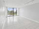 Spacious living room with sliding doors to balcony at 2424 W Tampa Bay Blvd # L-302, Tampa, FL 33607