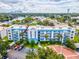 Aerial view of condo building with waterfront access and parking at 2424 W Tampa Bay Blvd # L-302, Tampa, FL 33607