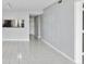 Living room with tile floors and kitchen pass-through at 2424 W Tampa Bay Blvd # L-302, Tampa, FL 33607