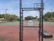 Tennis court with chain link fence and basketball hoop at 2424 W Tampa Bay Blvd # L-302, Tampa, FL 33607