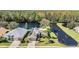 Aerial view of house and pond at 1533 Westerham Loop, Trinity, FL 34655