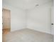 An empty bedroom with neutral carpet and bright white walls at 19395 Sheltered Hill Dr, Brooksville, FL 34601