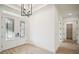 Bright entryway featuring stylish double doors, modern lighting, and hardwood floors at 19395 Sheltered Hill Dr, Brooksville, FL 34601