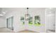 Light-filled living room with wood floors, recessed lighting, large windows, and a sliding glass door at 19395 Sheltered Hill Dr, Brooksville, FL 34601
