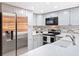 Close-up of a kitchen with stainless steel appliances and white countertops at 2154 Tarpon Landings Dr, Tarpon Springs, FL 34688