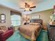 Bright bedroom featuring a comfortable bed and ample natural light at 14155 Whitecap Ave, Hudson, FL 34667