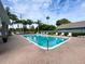 Community pool with lounge chairs at 14155 Whitecap Ave, Hudson, FL 34667