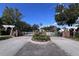 Gated community entrance with landscaping and brick pillars at 14937 Potterton Cir, Hudson, FL 34667