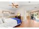 Spacious bedroom with wood floors and private access to deck at 41 Cypress Dr, Palm Harbor, FL 34684
