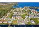 Aerial view of house on the lake with private dock at 41 Cypress Dr, Palm Harbor, FL 34684