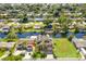 Aerial view of waterfront home with canal access and solar panels at 41 Cypress Dr, Palm Harbor, FL 34684