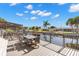 Deck overlooking a canal with table and chairs at 41 Cypress Dr, Palm Harbor, FL 34684