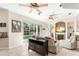 Living room with pool view and fireplace at 41 Cypress Dr, Palm Harbor, FL 34684