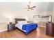 Main bedroom with a king-size bed and hardwood floor at 41 Cypress Dr, Palm Harbor, FL 34684