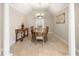 Formal dining room with decorative chandelier and tile floor at 41 Cypress Dr, Palm Harbor, FL 34684