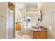 Bathroom with soaking tub, granite vanity, and walk-in shower at 41 Cypress Dr, Palm Harbor, FL 34684