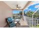 Relaxing screened balcony overlooking water views, complete with seating at 41 Cypress Dr, Palm Harbor, FL 34684