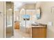 Elegant bathroom with soaking tub, granite vanity, and walk-in shower at 41 Cypress Dr, Palm Harbor, FL 34684