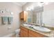 Bathroom with double vanity and granite countertops at 41 Cypress Dr, Palm Harbor, FL 34684