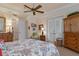 Main bedroom with sitting area and French doors at 9312 Gentle Ben Ct, Weeki Wachee, FL 34613