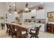 Large kitchen with white cabinets, granite countertops, and an island with seating at 9312 Gentle Ben Ct, Weeki Wachee, FL 34613