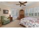Main bedroom with sitting area and French doors at 9312 Gentle Ben Ct, Weeki Wachee, FL 34613