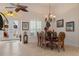 Bright dining room featuring a table with six chairs and plantation shutters at 9312 Gentle Ben Ct, Weeki Wachee, FL 34613