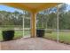 This screened patio offers a peaceful outdoor space at 9312 Gentle Ben Ct, Weeki Wachee, FL 34613