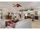 Open living space showcasing a comfortable seating area and views into the kitchen at 9312 Gentle Ben Ct, Weeki Wachee, FL 34613