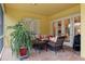 Spacious screened patio with brick flooring and plenty of seating at 9312 Gentle Ben Ct, Weeki Wachee, FL 34613