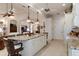 Island kitchen features granite countertops and breakfast bar at 9312 Gentle Ben Ct, Weeki Wachee, FL 34613