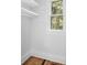 Closet with white shelves and hardwood floors at 321 S Brooksville Ave, Brooksville, FL 34601