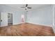 Spacious bedroom with hardwood floors and ensuite bathroom access at 321 S Brooksville Ave, Brooksville, FL 34601