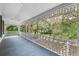 Long porch with ornate railing and view of trees at 321 S Brooksville Ave, Brooksville, FL 34601