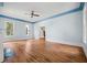 Hardwood floors, fireplace, and ceiling fan at 321 S Brooksville Ave, Brooksville, FL 34601