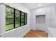 Kitchen boasts lavender cabinets, herringbone floors and a farmhouse sink at 321 S Brooksville Ave, Brooksville, FL 34601