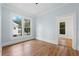 Well-lit bedroom featuring hardwood floors and large windows at 321 S Brooksville Ave, Brooksville, FL 34601