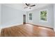 Bright bedroom with hardwood floors and ceiling fan at 321 S Brooksville Ave, Brooksville, FL 34601