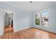 Hardwood floor bedroom with light walls and view of hallway at 321 S Brooksville Ave, Brooksville, FL 34601