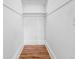 Small closet with wood floors and white walls at 321 S Brooksville Ave, Brooksville, FL 34601